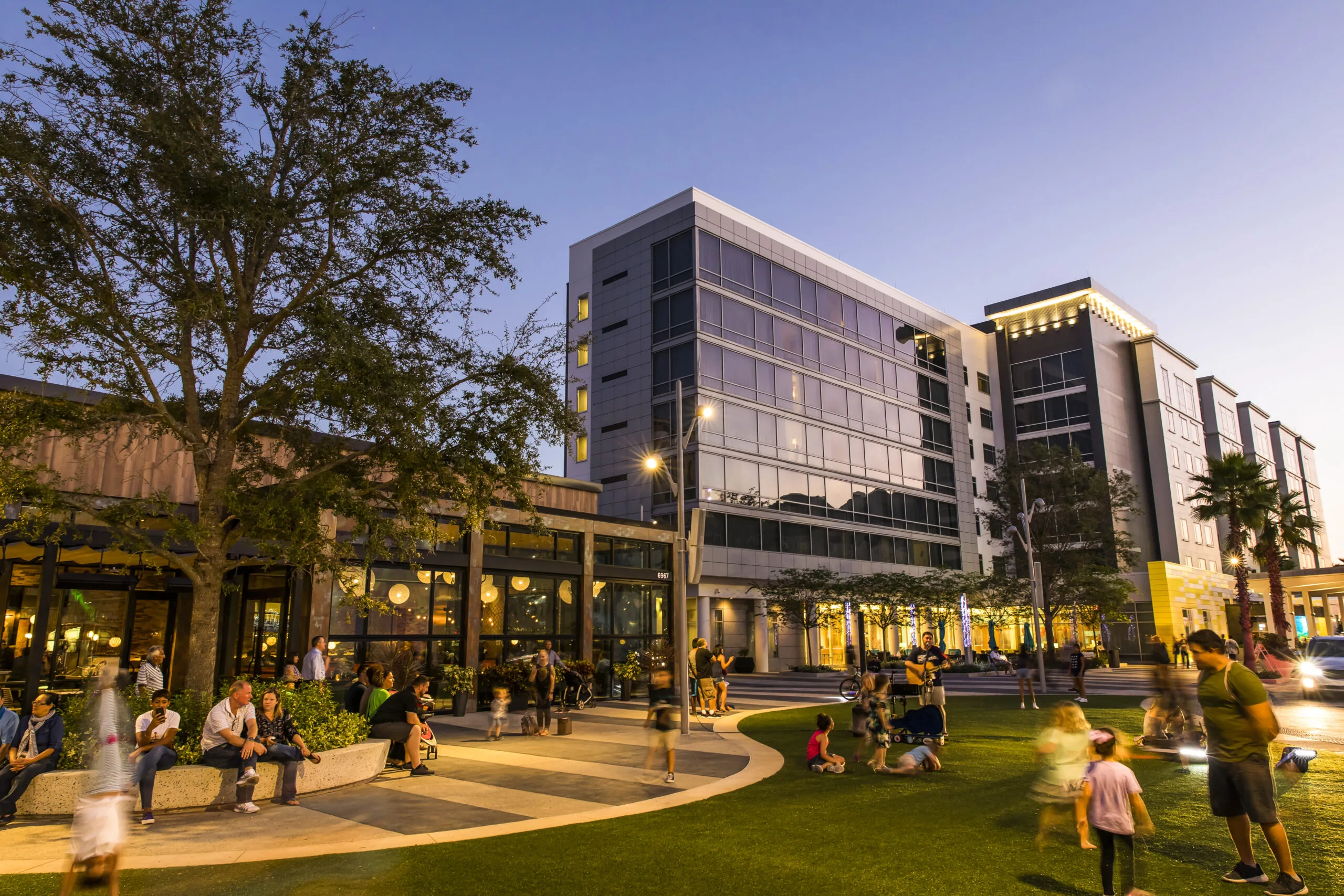 Lake Nona Town Center evening with green space dining and community activity in southeast Orlando Florida